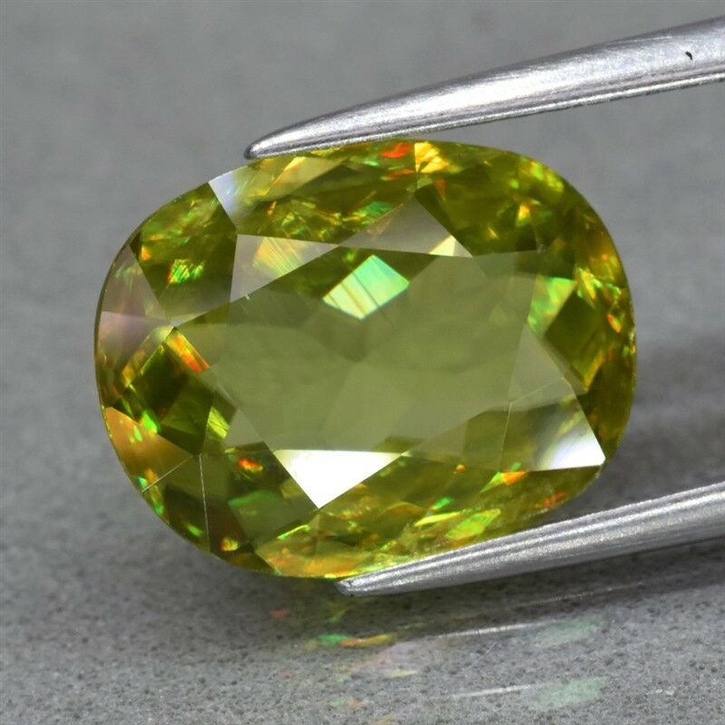 3.77ct 12.2x9.5mm Oval Natural Yellowish Green Sphene, Diamond Luster